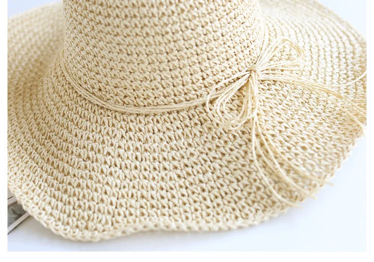 Stylish brown straw sun hat, foldable, designed for children's beach adventures.