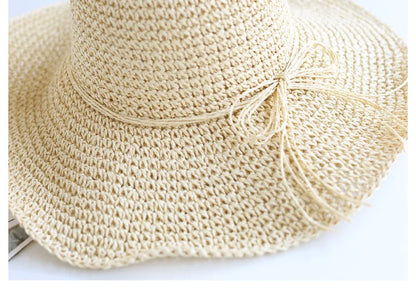 Stylish brown straw sun hat, foldable, designed for children's beach adventures.