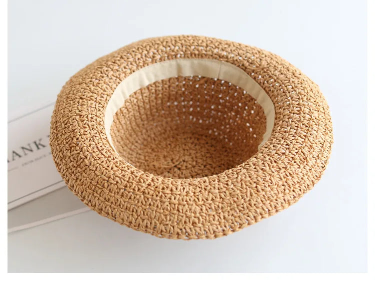 Summer fashion for kids: foldable beige straw sun hat, practical & cute.