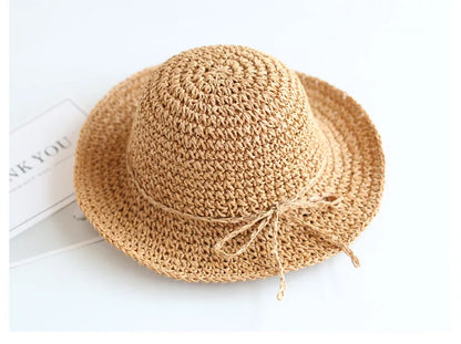 Summer hat for kids: beige linen straw, foldable & comfortable for sunny days.