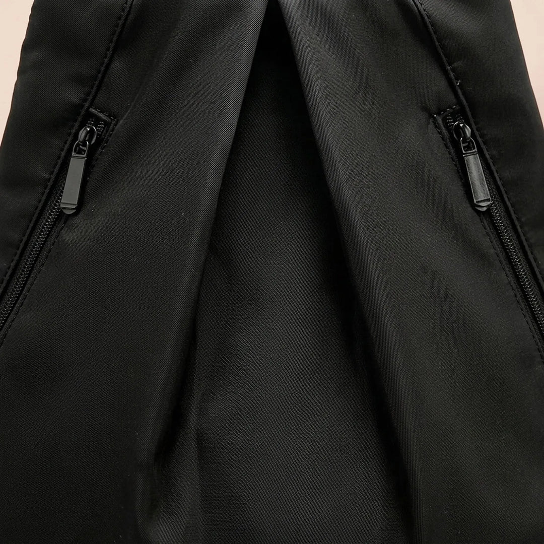 Close-up of beige water-repellent adventure backpack fabric, durable for hiking & travel.