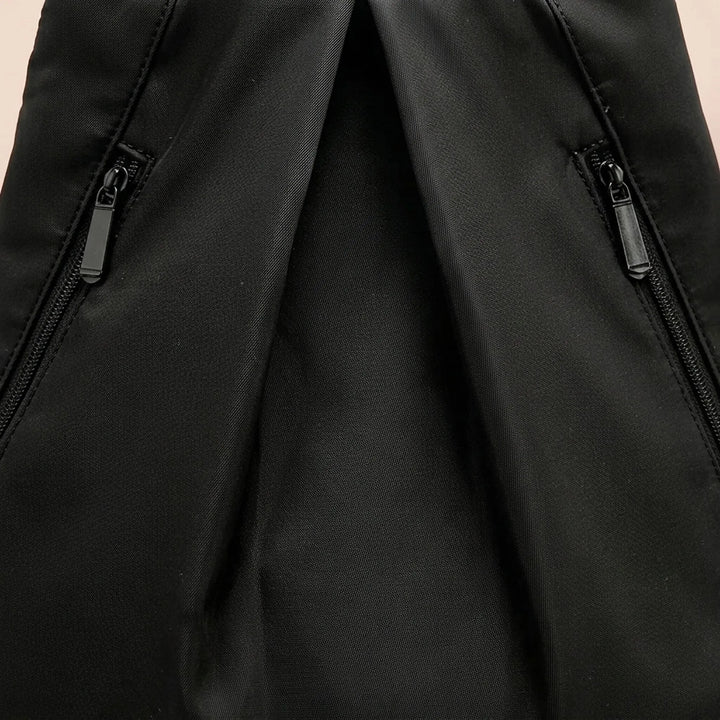 Close-up of beige water-repellent adventure backpack fabric, durable for hiking & travel.