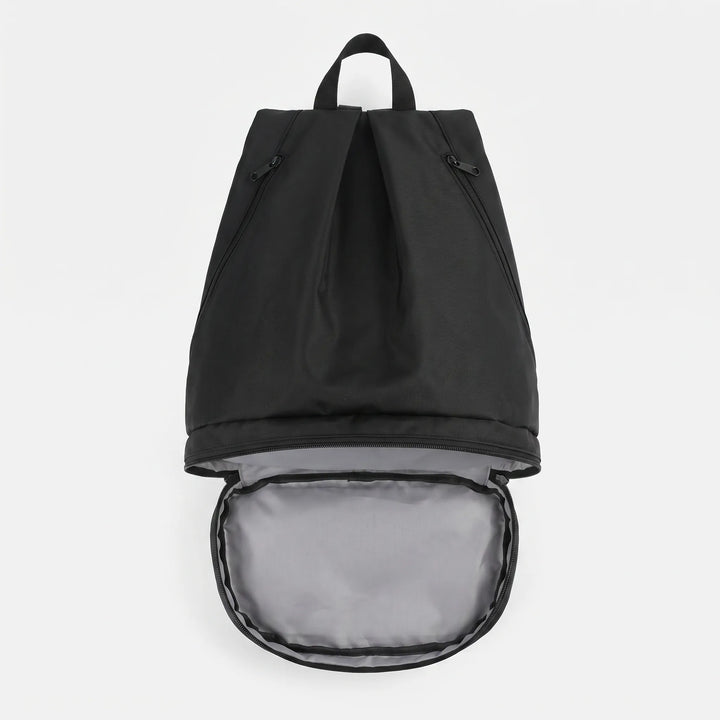 Hiker wearing beige water-repellent adventure backpack, unisex travel pack for outdoor exploration.