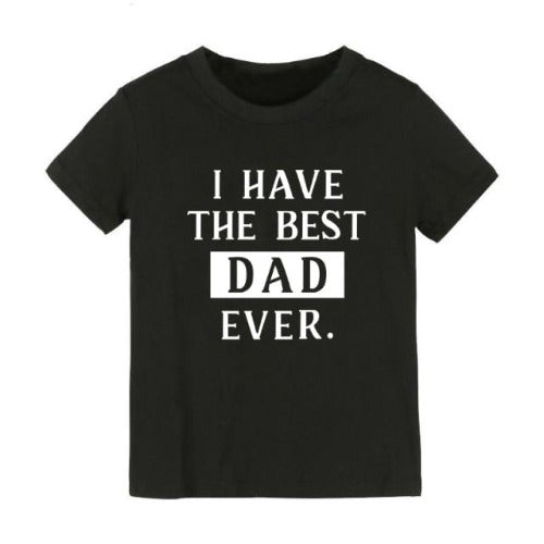 Close-up of 'Best Dad' graphic print on a white toddler t-shirt, unisex casualwear baby clothing