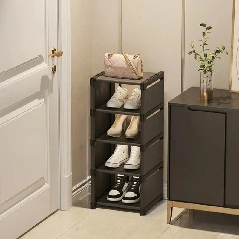 Black corner shoe rack organizing an entryway, keeping shoes tidy and maximizing small space.