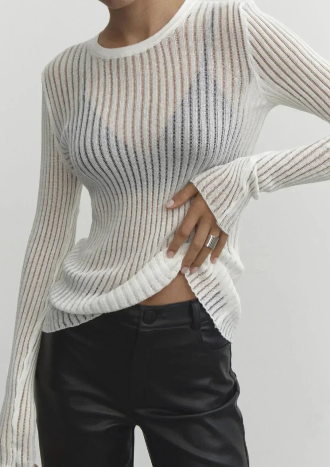 White sheer textured women's long sleeve top, fitted & chic, ideal for casual or evening wear.