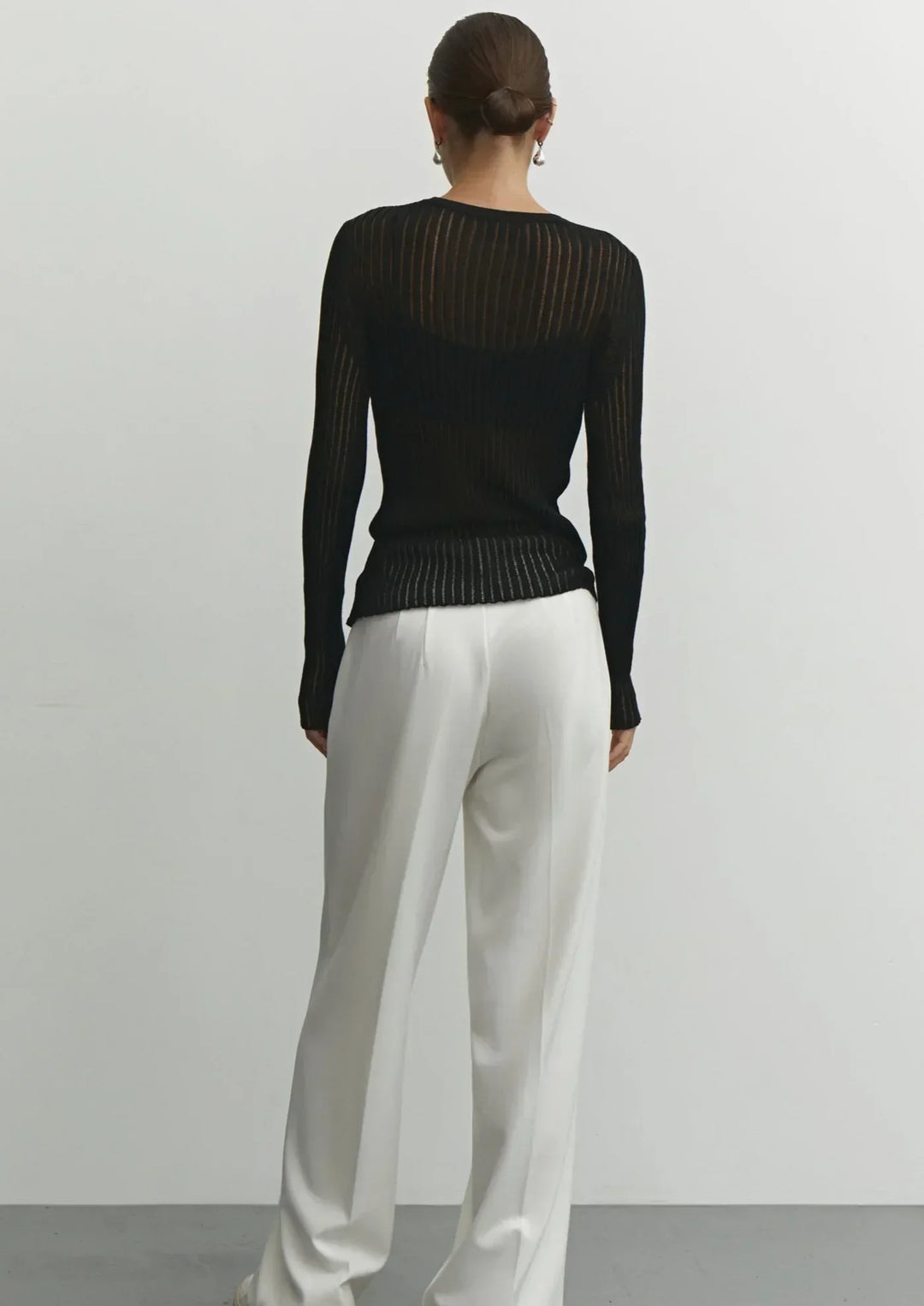 Trendy women's sheer textured long sleeve top, fitted for an elegant & versatile fashion statement.