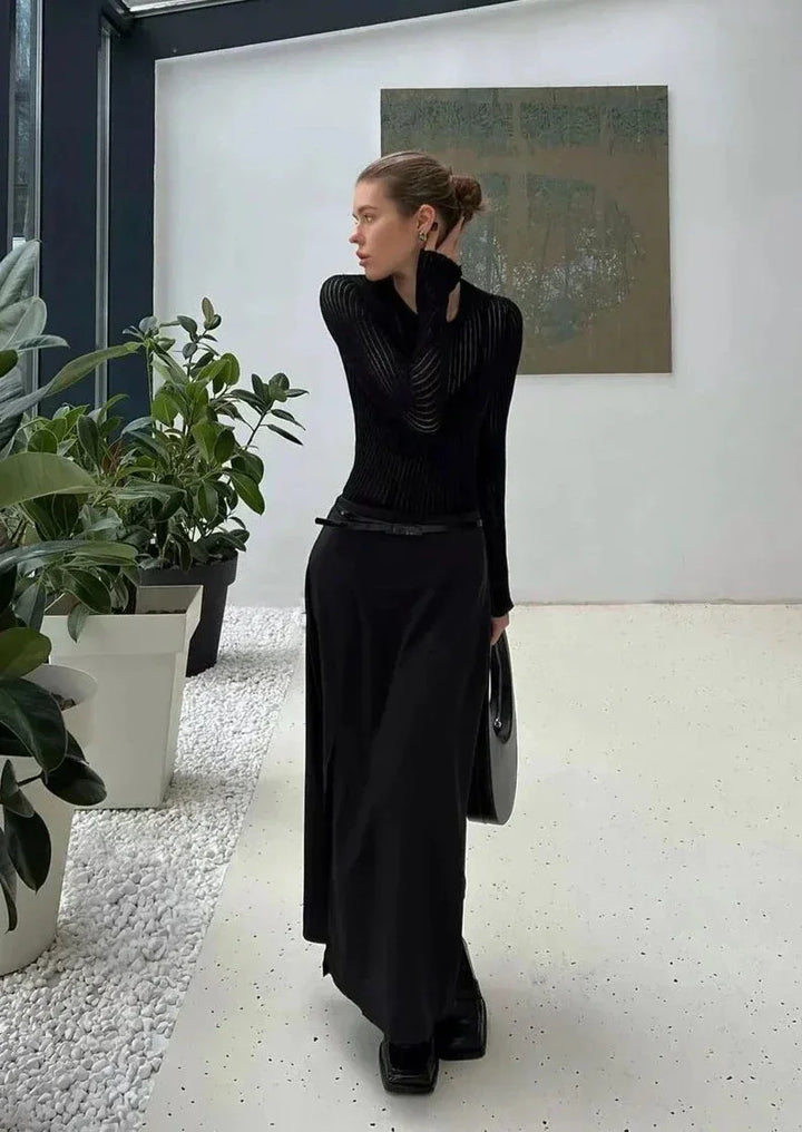 Chic sheer textured long sleeve women's top, great for layering or as a standalone statement piece.