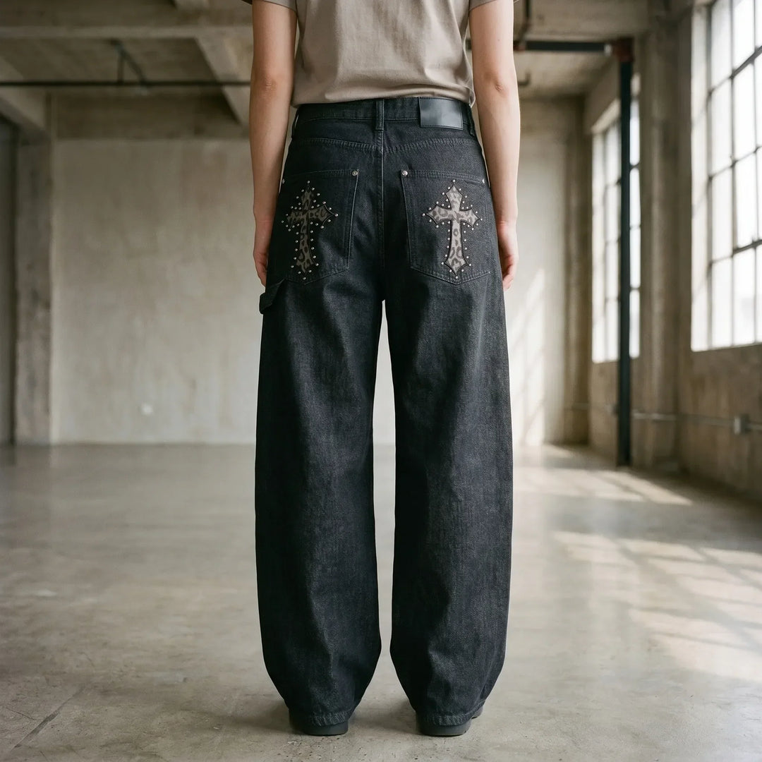 Black studded baggy wide-leg pants for women. Edgy streetwear, grunge, and punk style with a low-rise fit.