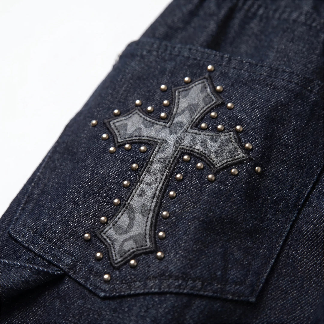 Model wearing black wide-leg studded pants. Baggy fit, metal studs, and a low-rise cut for a bold streetwear look.