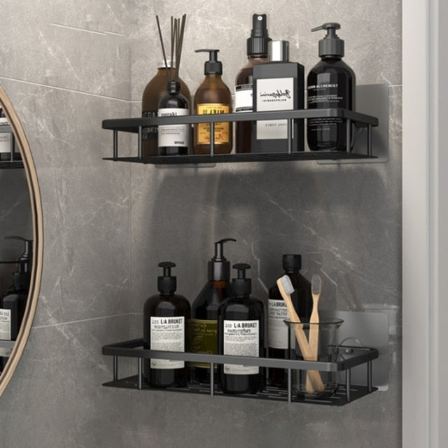 Black suction cup wall organizer for toiletries & soaps, easy and quick installation.