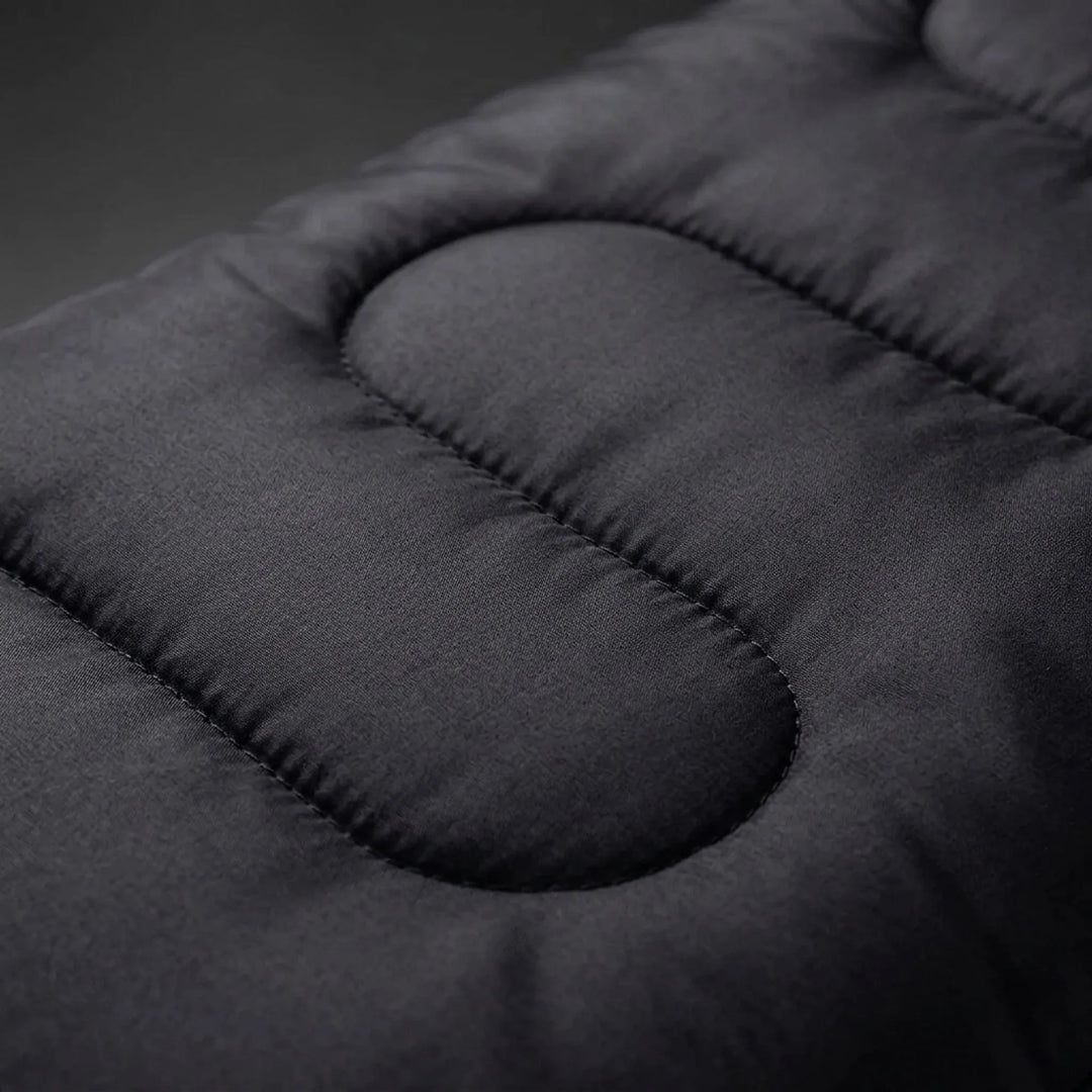Black envelope-style sleeping bag. Lightweight & portable for hiking, camping, and outdoor adventures.