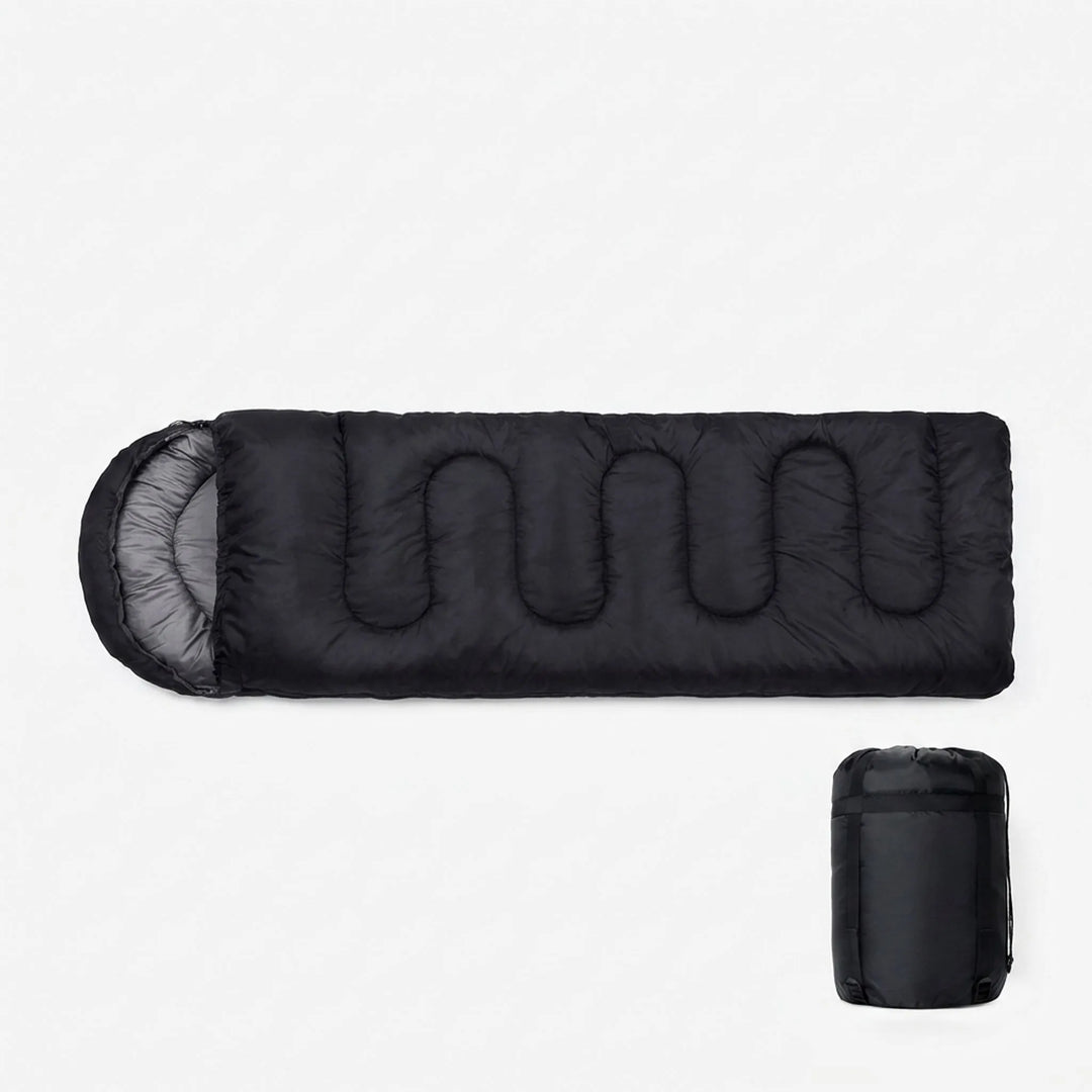 Rolled black ultralight sleeping bag in compression sack, ideal for hiking & backpacking. Compact camping gear.