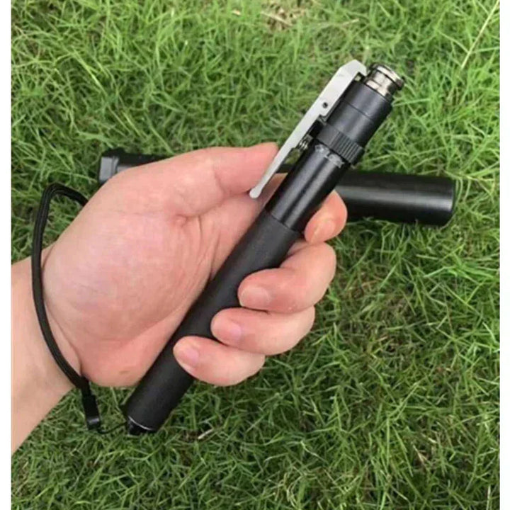 Folded black collapsible walking stick, compact for travel. Essential portable mobility aid & hiking gear.