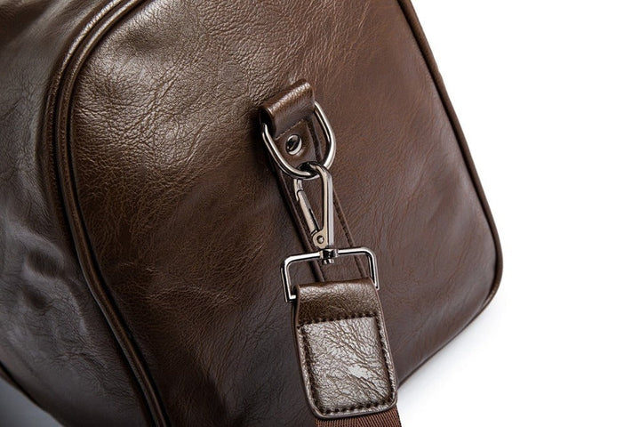 Lightweight faux leather travel duffel in classic black, ideal weekend bag with ample storage.