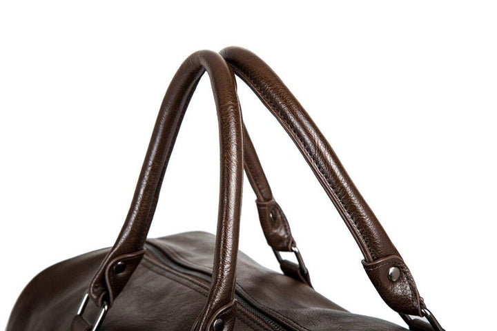 Elegant brown faux leather duffel, unisex and lightweight for all your stylish travel requirements.