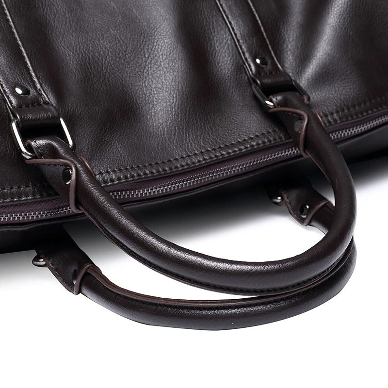 Unisex travel duffel in rich brown faux leather, great for gym essentials or a quick carry-on.