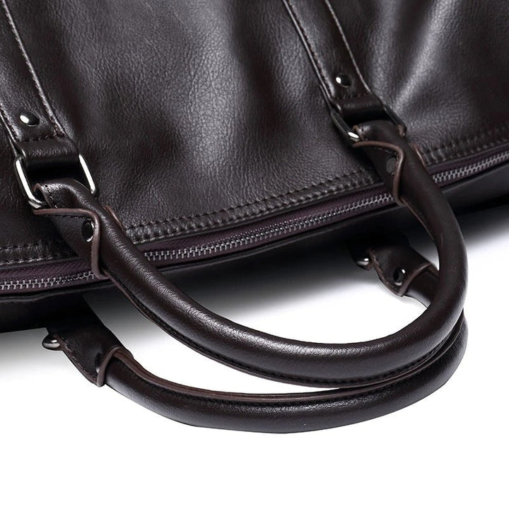 Unisex travel duffel in rich brown faux leather, great for gym essentials or a quick carry-on.