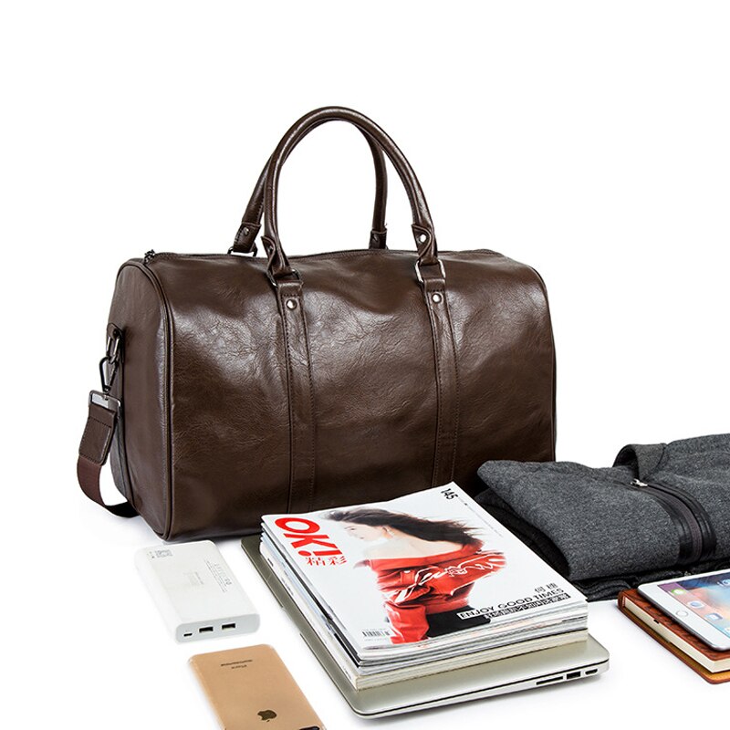 Durable black faux leather duffel, lightweight & unisex design, ideal for gym or travel adventures.