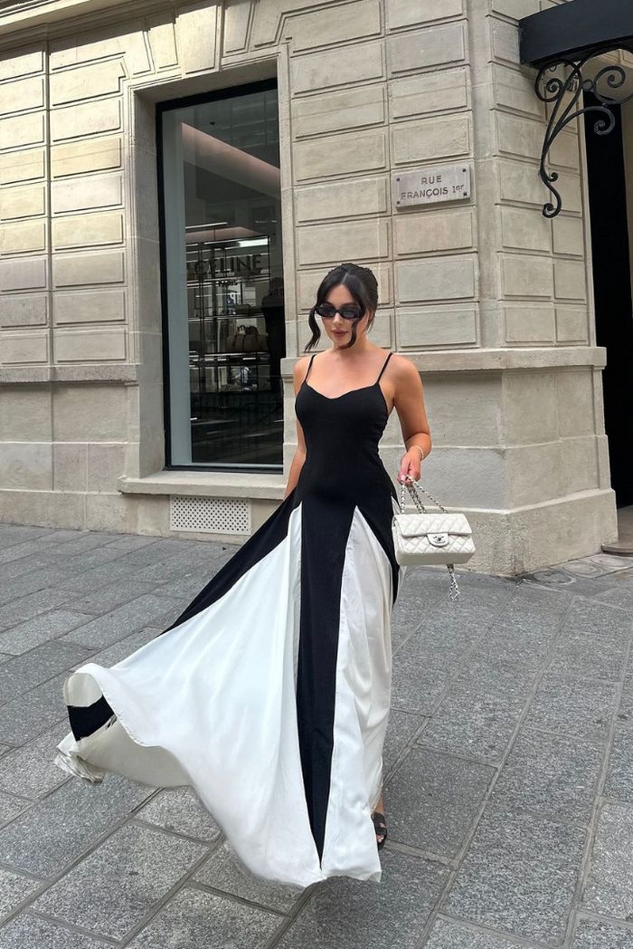 Timeless black and white contrast maxi dress, ideal for a formal wedding guest.