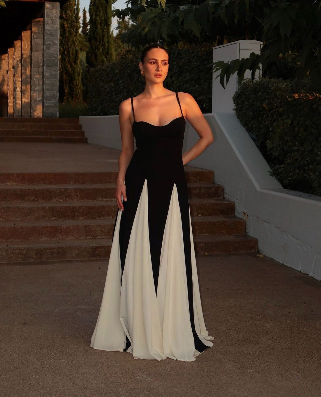 Elegant ladies' black and white contrast wedding guest maxi dress, timeless style.