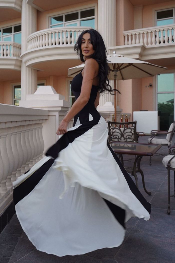 Timeless black and white formal maxi dress, chic for any special occasion.