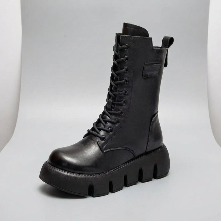 Chunky women's combat boots with supportive arch, platform sole & classic lace-up design, perfect for daily wear.