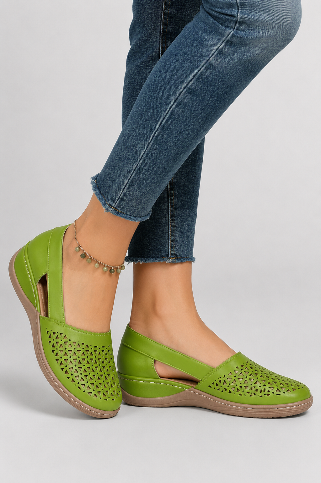 Stylish black women's cutout shoes. Fashionable everyday walking footwear providing breathable comfort.
