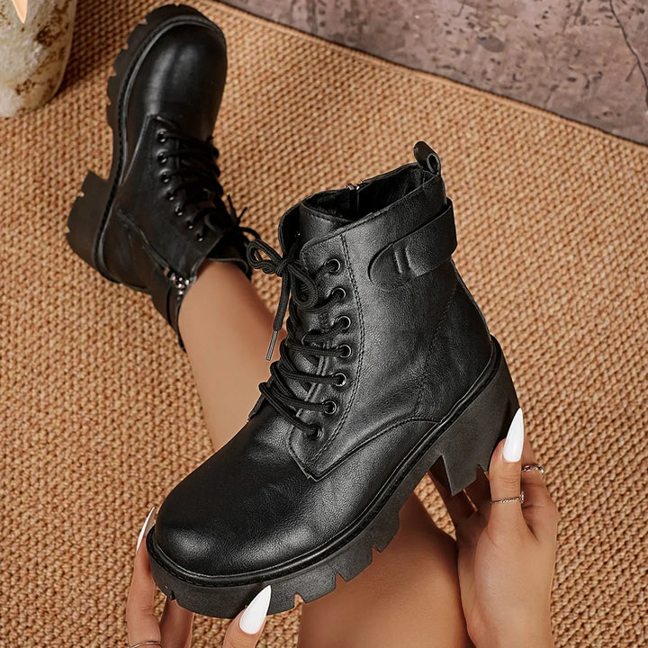 Stylish women's lace-up platform ankle boots in black, featuring a chunky lug sole for fall & winter.