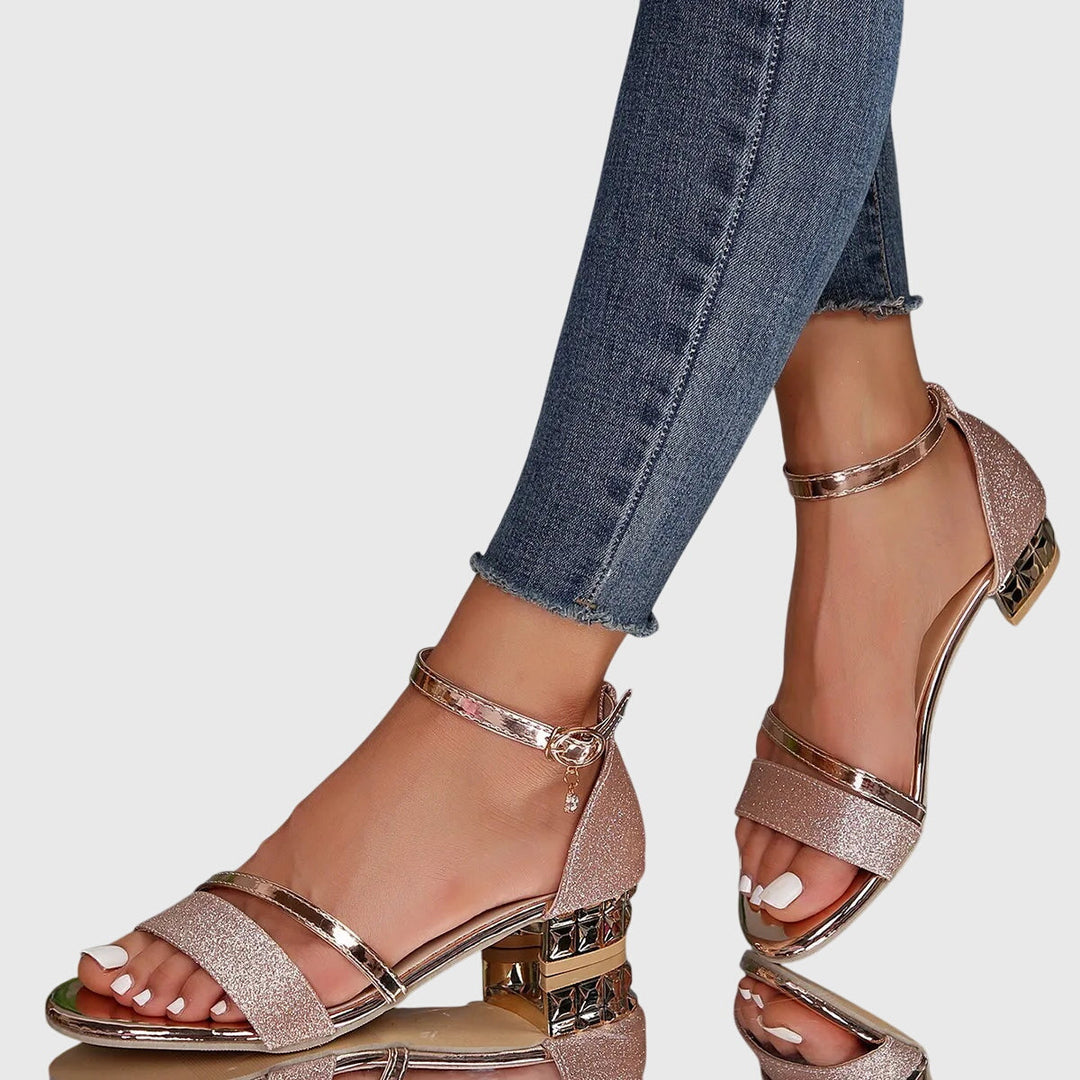 Black heeled orthopedic sandals for women, designed for foot pain relief with adjustable straps & strong arch support.