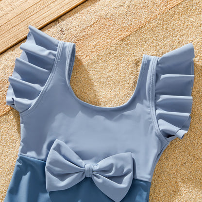 Stylish blue family swimwear, featuring a modern bow design for summer