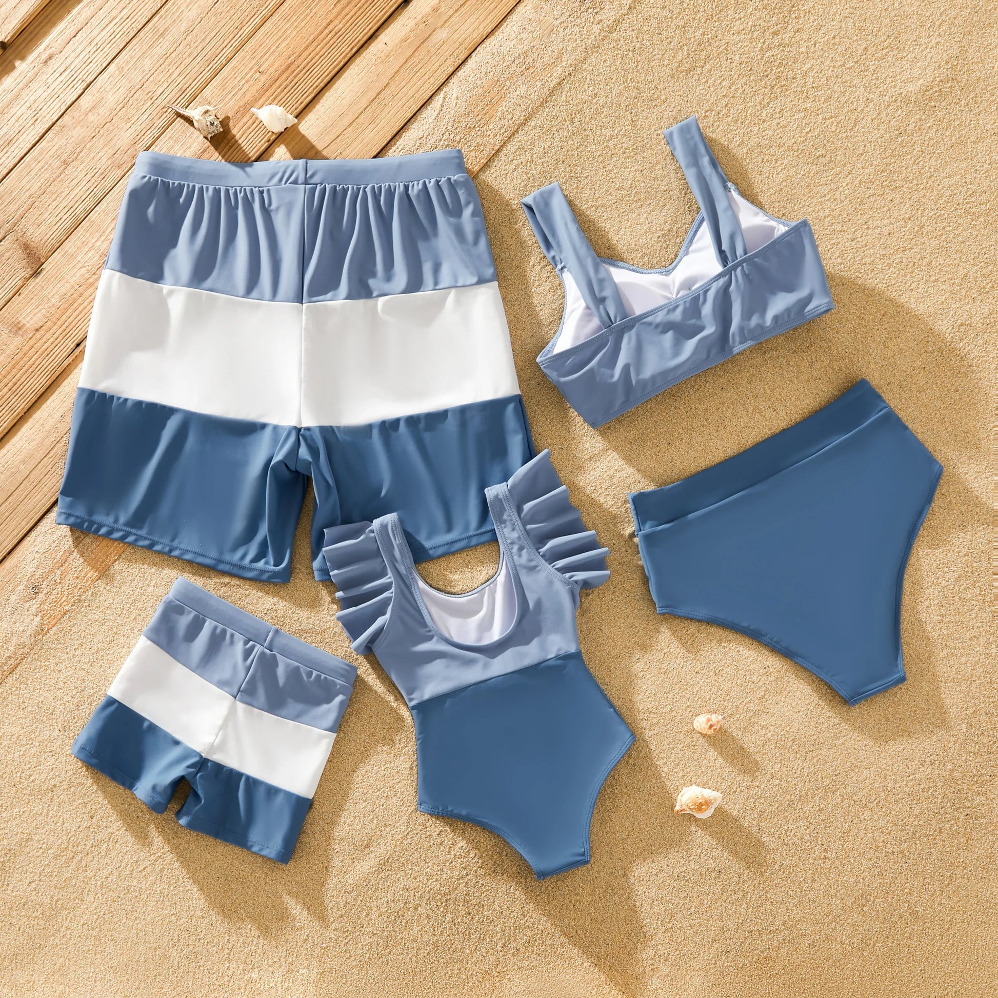Family in blue matching swimsuits with bow-knot detail, perfect for beach outfits