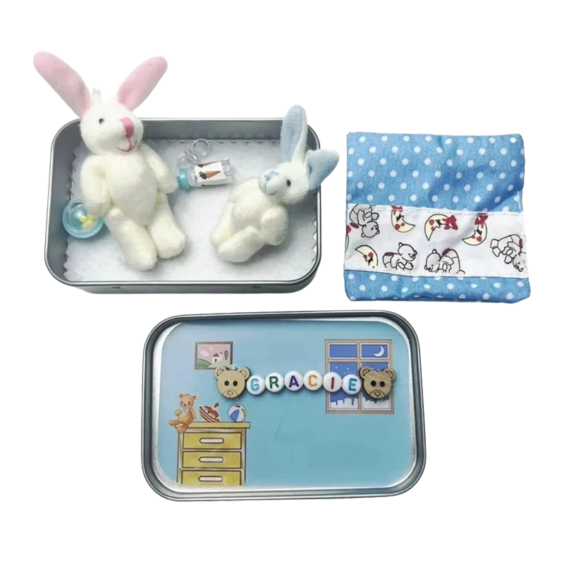 Two pocket plush bunnies, blue and pink, in keepsake tins, ideal kids' toys and travel friends.