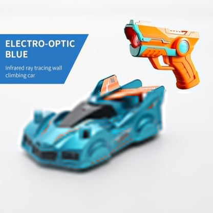Set of two blue wall climbing RC cars racing up a painted wall