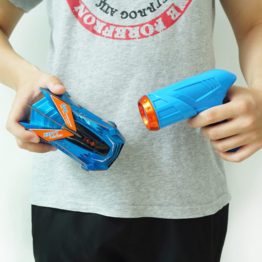 Action shot of blue RC wall climber toy speeding across a ceiling