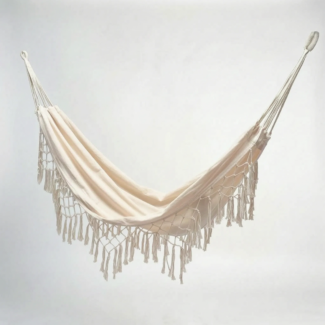 Unisex white cotton tasseled outdoor hanging hammock chair, a perfect bohemian porch swing for summer.