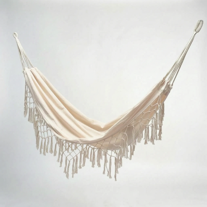 Unisex white cotton tasseled outdoor hanging hammock chair, a perfect bohemian porch swing for summer.