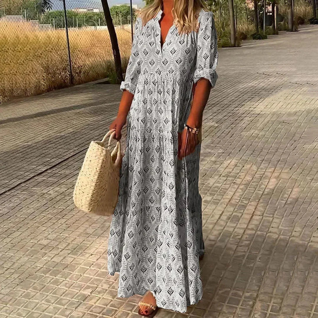 Stylish women's bohemian V-neck maxi dress with long sleeves. Ideal for summer, casual outings, or elegant vacation wear.
