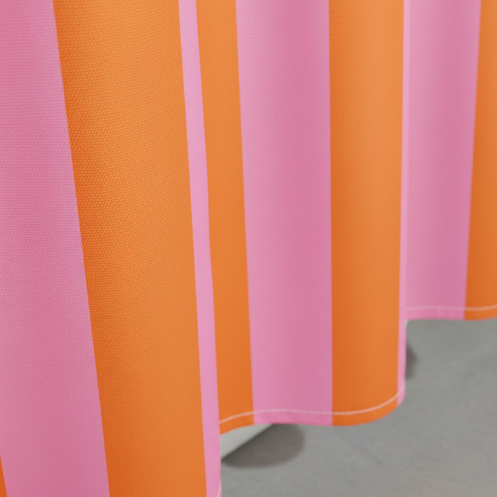 Modern boho striped fabric shower curtain, stylish bathroom decor accent.