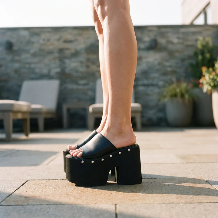 Bold black platform sandals for women, featuring a chunky 5.5-inch block heel, open toe, and slip-on design.