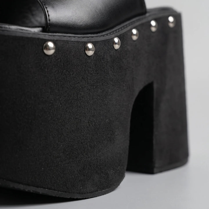 Chunky 5.5-inch block heel black platform sandals for women. Open-toe slip-on footwear, ideal for bold fashion.