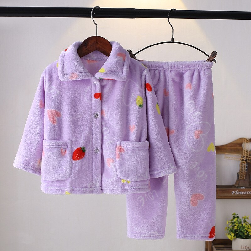 Smiling boy wearing cozy flannel winter pajamas, perfect for cold nights, boys' sleepwear.