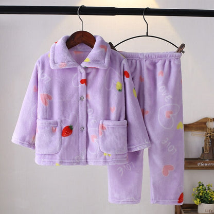 Smiling boy wearing cozy flannel winter pajamas, perfect for cold nights, boys' sleepwear.