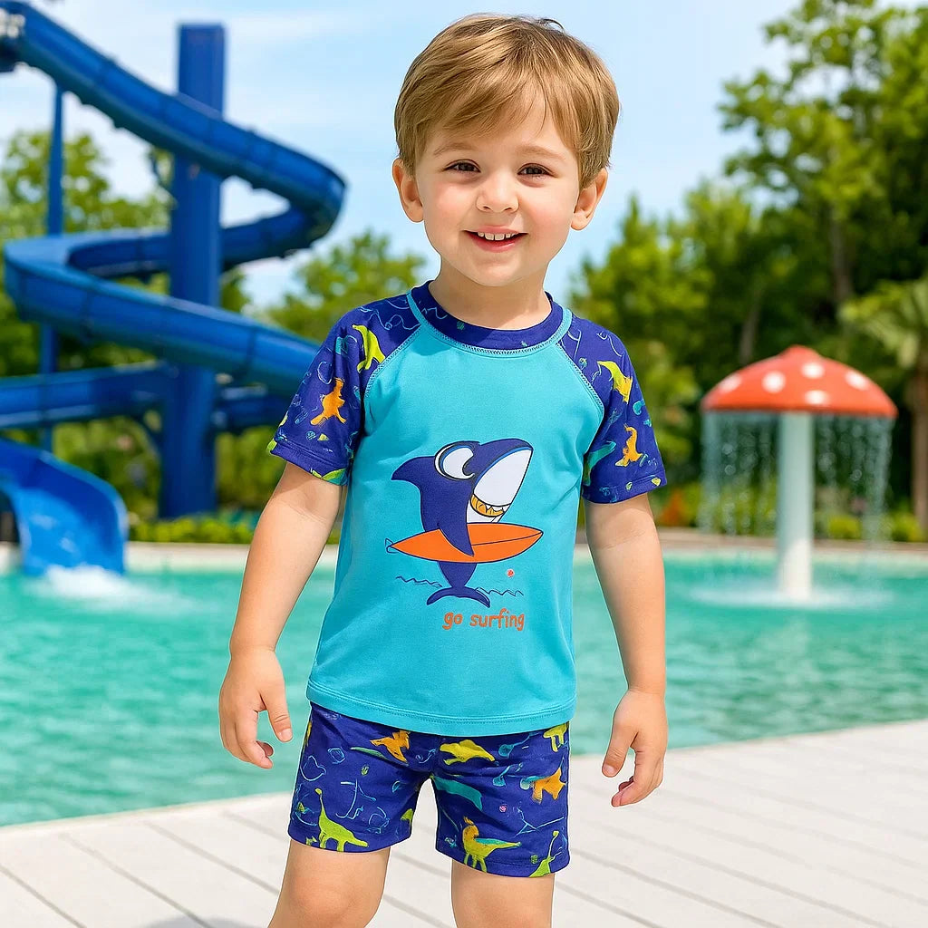 Girl's pink UPF 50+ sun protection swimsuit set with unicorn print, long-sleeve top and bottoms.