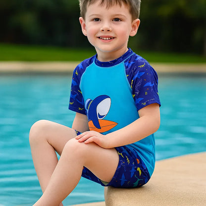 Children's UPF 50+ sun protection swimwear with vibrant jungle animal print, ideal for pool and beach.