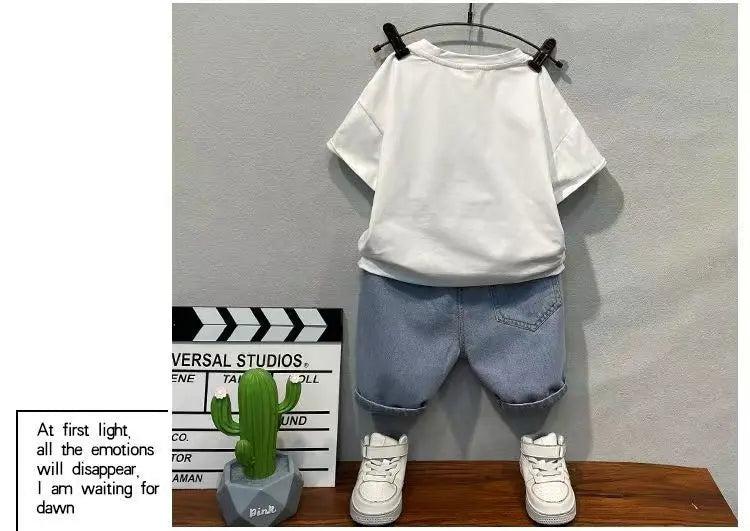 Close-up of a boy's summer t-shirt and denim shorts set, ideal kids fashion