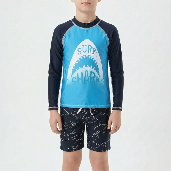Active youth boys' swimwear set designed for pool & ocean adventures, featuring a protective rash guard & comfy shorts.