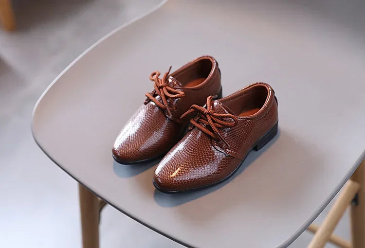 Boys' party shoes in black PU leather, perfect for festive occasions and formal wear.
