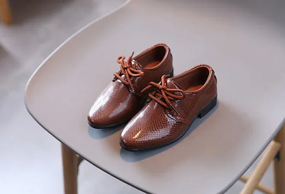 Boys' party shoes in black PU leather, perfect for festive occasions and formal wear.