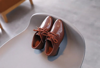 Toddler formal black shoes, versatile for church, school, or family gatherings.